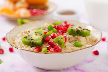 Tasty and healthy oatmeal porridge with fruit, berry and flax seeds. Healthy breakfast. Fitness food. Proper nutrition. Breakfast on Valentine's Day.