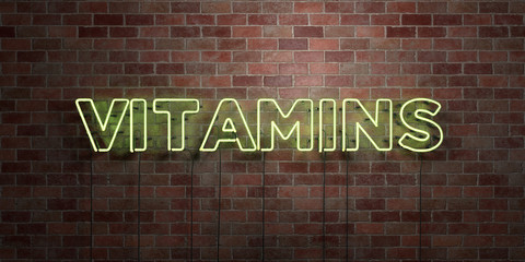 VITAMINS - fluorescent Neon tube Sign on brickwork - Front view - 3D rendered royalty free stock picture. Can be used for online banner ads and direct mailers..