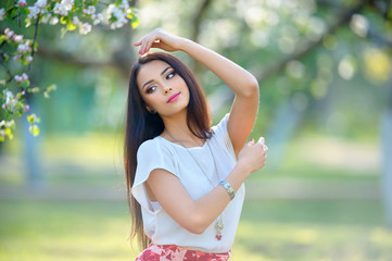 Naklejka premium Outdoors portrait of european young woman with luxury spring jew