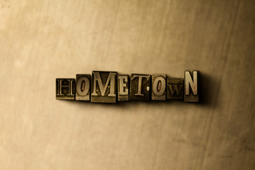 Naklejka premium HOMETOWN - close-up of grungy vintage typeset word on metal backdrop. Royalty free stock - 3D rendered stock image. Can be used for online banner ads and direct mail.