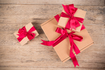 Brown gift box on brown wooden background