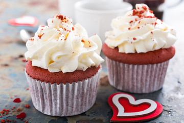 Delicious red velvet cupcakes on rusty old metal background. Valentines Day food.