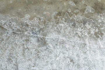 Naklejka na ściany i meble Beautiful ice with abstract cracks. Macro shot.