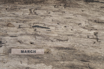 cube calendar for march on wooden background