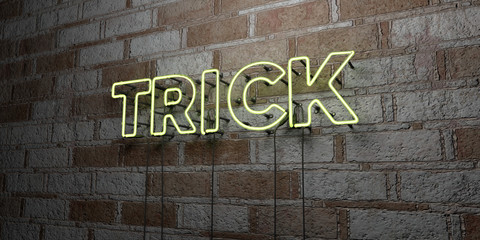 TRICK - Glowing Neon Sign on stonework wall - 3D rendered royalty free stock illustration.  Can be used for online banner ads and direct mailers..