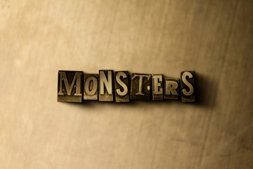 MONSTERS - close-up of grungy vintage typeset word on metal backdrop. Royalty free stock - 3D rendered stock image.  Can be used for online banner ads and direct mail.