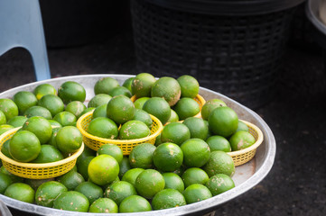 fresh lime in basket at market thailand