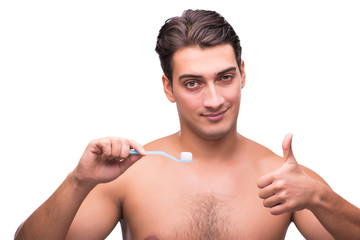 Man brushing his teeth isolated on white