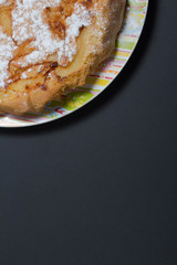 photon picture of cake on the plate you can write in white letters the recipe of your Apple pie or any of Durga lettering on a black background