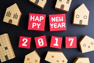 Happy new year 2017 number on red paper box cubes and home archi