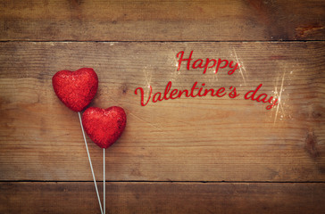 Valentines day background. Couple of red glitter hearts
