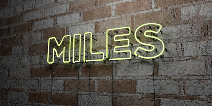 MILES - Glowing Neon Sign on stonework wall - 3D rendered royalty free stock illustration.  Can be used for online banner ads and direct mailers..