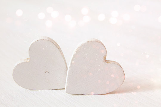 Valentines day background. Couple of wooden hearts