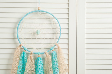 Blue beige dream catcher with crocheted doilies
