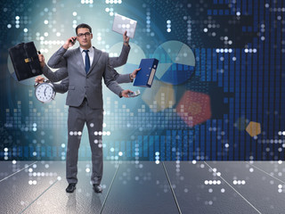 Young businessman in multitasking concept