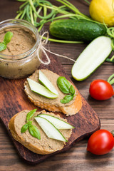 Liver pate with baguette. On a wooden rustic background. Close-up
