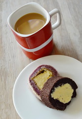 chocolate and grape cake roll filled cream eat couple with coffee in red cup
