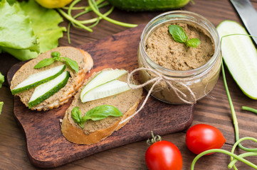 Liver pate with baguette. On a wooden rustic background. Close-up