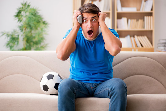 Man Watching Football At Home