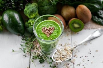 fresh and tasty green smoothie with ingredients