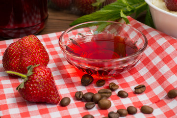 Strawberry jam. On a wooden table. Top view. Close-up
