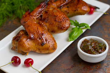Marinated chicken wings in Japanese. On a Old table. Top view. Close-up