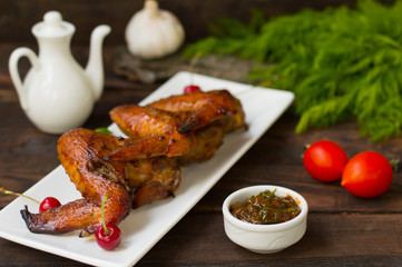 Marinated chicken wings in Japanese. On a wooden table. Top view. Close-up