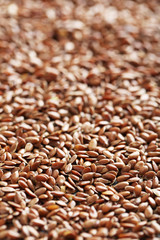 Brown flax seeds background