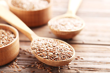 Brown flax seeds on a wooden table