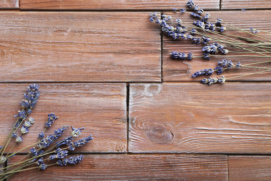Bunch of lavender flowers on brown wooden background