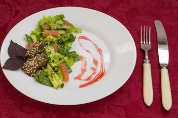 Salad with liver in sesame and grapefruit. Wooden table. Top view. Close-up