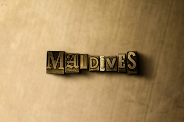 MALDIVES - close-up of grungy vintage typeset word on metal backdrop. Royalty free stock - 3D rendered stock image.  Can be used for online banner ads and direct mail.
