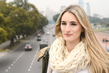 Portrait of a young woman outdoors.