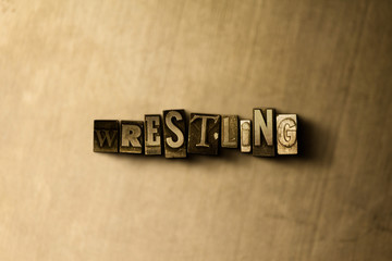 WRESTLING - close-up of grungy vintage typeset word on metal backdrop. Royalty free stock - 3D rendered stock image.  Can be used for online banner ads and direct mail.