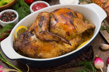 Grilled chicken marinated in balsamic sauce, spicy Italian herbs and fresh lemon. Restaurant supply on a wooden table. Close-up. Top view
