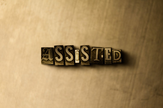 ASSISTED - close-up of grungy vintage typeset word on metal backdrop. Royalty free stock - 3D rendered stock image.  Can be used for online banner ads and direct mail.