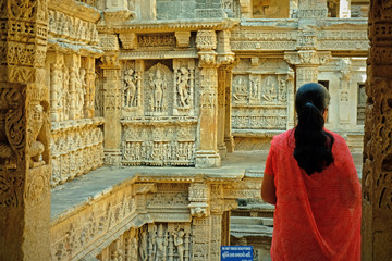Unidentified woman admiring some of the 800 sculptures at the 11th century Queens Stepwell  at...