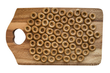 The background of the little big bagels on a wooden Board