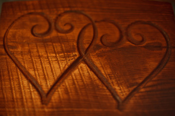 Two hearts on a wooden table