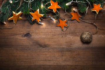 Holidays background with hand made decorations on wooden board