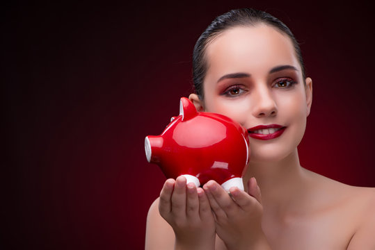 Young Woman With Red Piggybank