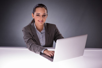 Businesswoman with laptop in business concept