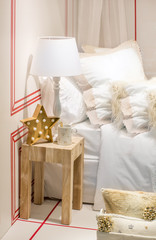 Christmas composition of a star chandelier, mug and a golden spo