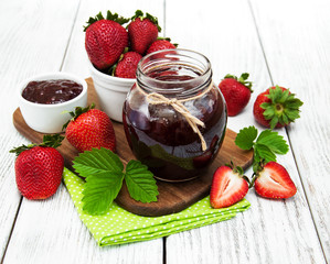 Strawberry jam and fresh strawberries