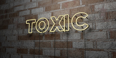TOXIC - Glowing Neon Sign on stonework wall - 3D rendered royalty free stock illustration.  Can be used for online banner ads and direct mailers..