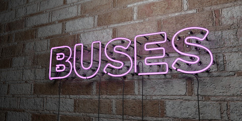 BUSES - Glowing Neon Sign on stonework wall - 3D rendered royalty free stock illustration.  Can be used for online banner ads and direct mailers..
