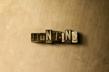 HUNTING - close-up of grungy vintage typeset word on metal backdrop. Royalty free stock - 3D rendered stock image.  Can be used for online banner ads and direct mail.