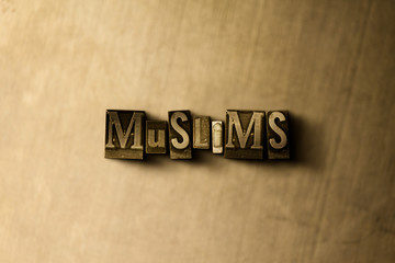 MUSLIMS - close-up of grungy vintage typeset word on metal backdrop. Royalty free stock - 3D rendered stock image.  Can be used for online banner ads and direct mail.