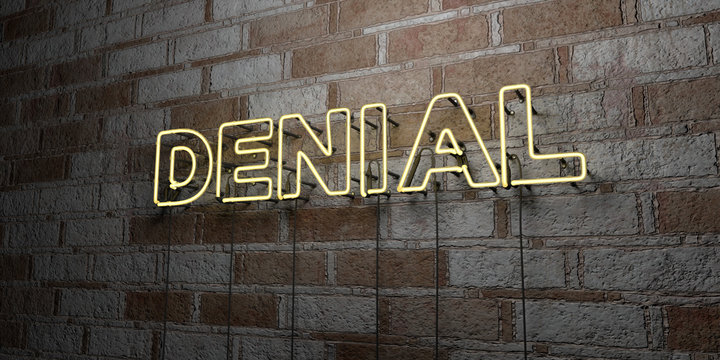 DENIAL - Glowing Neon Sign on stonework wall - 3D rendered royalty free stock illustration.  Can be used for online banner ads and direct mailers..