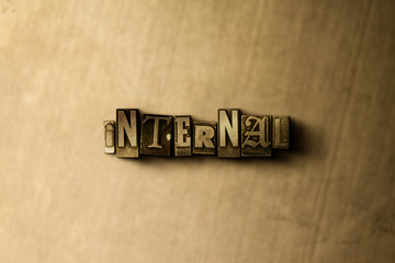 INTERNAL - close-up of grungy vintage typeset word on metal backdrop. Royalty free stock - 3D rendered stock image.  Can be used for online banner ads and direct mail.